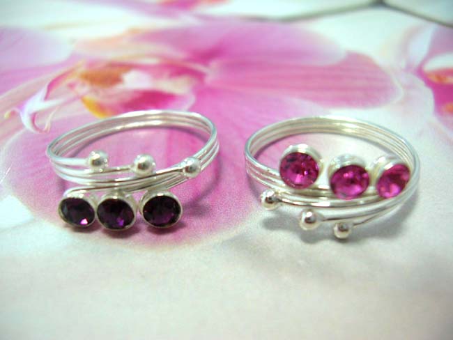 Jewelry collectible exchange. 3 cz crystals inlaid on bead triple bead and band toering, made from 925. sterling silver