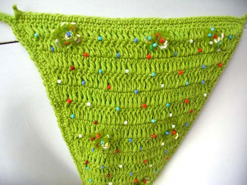 Ladies beach string bikini in sexy crochet knit with multi colored beads and sequin sold at wholesale cost from import supply manufacturer