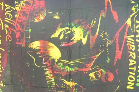 Artisan sarong distributor manufactures unique Bob Marley playing guitar print on caribbean beach wrap