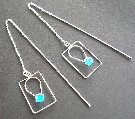 Premier design threader jewelry in sterling silver in rectangular design holding a blue Cz       