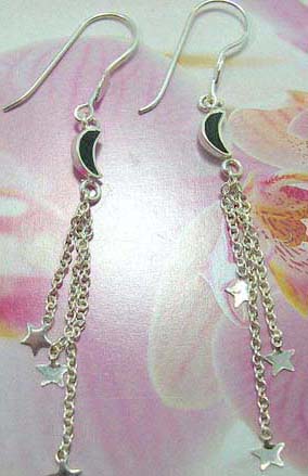 Fish hook sterling silver earring with black moon holding long chain and star on the bottom